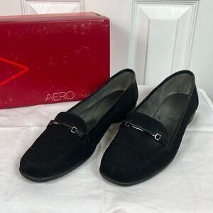 Aerosols black  slip on size 8M surreal. Metal piece on front